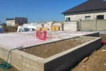 Дом «Данияр» 130 м², Астана, 2026: на утеплённом основании фундамента уложены контуры водяного тёплого пола