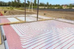 Дом «Игорь» 200 м², Талгар, 2026: тёплый пол готов под стяжку, на заднем плане горы