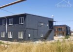 Проект дома «К-279ББ» из СИП-панелей, 279 м² — двухэтажный дом с тёмно-серым фасадом и наружной лестницей | HotWell.KZ