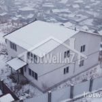 Проект дома «Б-286ВВ» из СИП-панелей, 286 м² — двухэтажный дом со светлой штукатуркой и террасой зимой | HotWell.KZ
