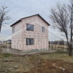 Проект дома «А-100» из СИП-панелей, 100 м² — двухэтажный дом обшитый розовым пеноплэксом с двускатной крышей | HotWell.KZ