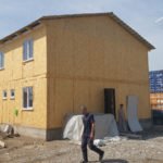 Проект дома «А-208» из СИП-панелей, 208 м² — двухэтажный строящийся дом из сип-панелей с серой шатровой крышей | HotWell.KZ