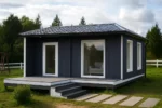 Проект дома «Б-40» из СИП-панелей, 40 м² — одноэтажный дом с тёмно-синим фасадом, серой крышей и террасой | HotWell.KZ