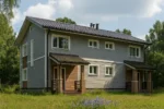 Проект дома «Ч-253» из СИП-панелей, 253 м² — двухэтажный дом с серым фасадом, темной крышей и двумя крыльцами | HotWell.KZ