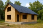 Дом «Д-90», 90 м², 1,5 этажа, в черновой отделке: коробка из СИП-панелей OSB-3, двускатная кровля из металлочерепицы, проёмы без окон и дверей, в проёмах видны сосновые балки перекрытия