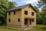 Дом «Х-183», 183 м², 2 этажа, в черновой отделке: коробка из СИП-панелей OSB-3, двускатная кровля из металлочерепицы, проёмы без окон и дверей, в проёмах видны сосновые балки перекрытия