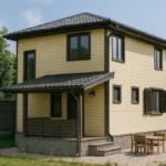 Проект дома «И-123» из СИП-панелей, 123 м² — двухэтажный дом с жёлтым фасадом, серой крышей и крыльцом | HotWell.KZ