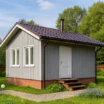 Проект дома «К-25» из СИП-панелей, 25 м² — одноэтажный дом с серым фасадом, коричневой крышей и крыльцом | HotWell.KZ