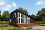 Проект дома «К-93В» из СИП-панелей, 93 м² — одноэтажный дом с темным фасадом, панорамными окнами и террасой | HotWell.KZ