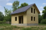 Дом «М-112В», 112 м², 1.5 этажа, в черновой отделке: коробка из СИП-панелей OSB-3, двускатная кровля из металлочерепицы, проёмы без окон и дверей, в проёмах видны сосновые балки перекрытия