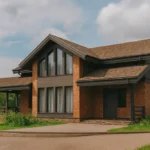 Проект дома «О-154» из СИП-панелей, 154 м² — двухэтажный дом с кирпичным фасадом, коричневой крышей и террасой | HotWell.KZ