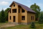 Дом «Р-189», 189 м², 1.5 этажа, в черновой отделке: коробка из СИП-панелей OSB-3, двускатная кровля из металлочерепицы, проёмы без окон и дверей, в проёмах видны сосновые балки перекрытия