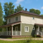 Проект дома «Ш-154» из СИП-панелей, 154 м² — двухэтажный дом с зелёным фасадом, коричневой крышей и террасой | HotWell.KZ