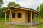 Дом «В-34», 34 м², 1 этаж, в черновой отделке: коробка из СИП-панелей OSB-3, двускатная кровля из металлочерепицы, проёмы без окон и дверей